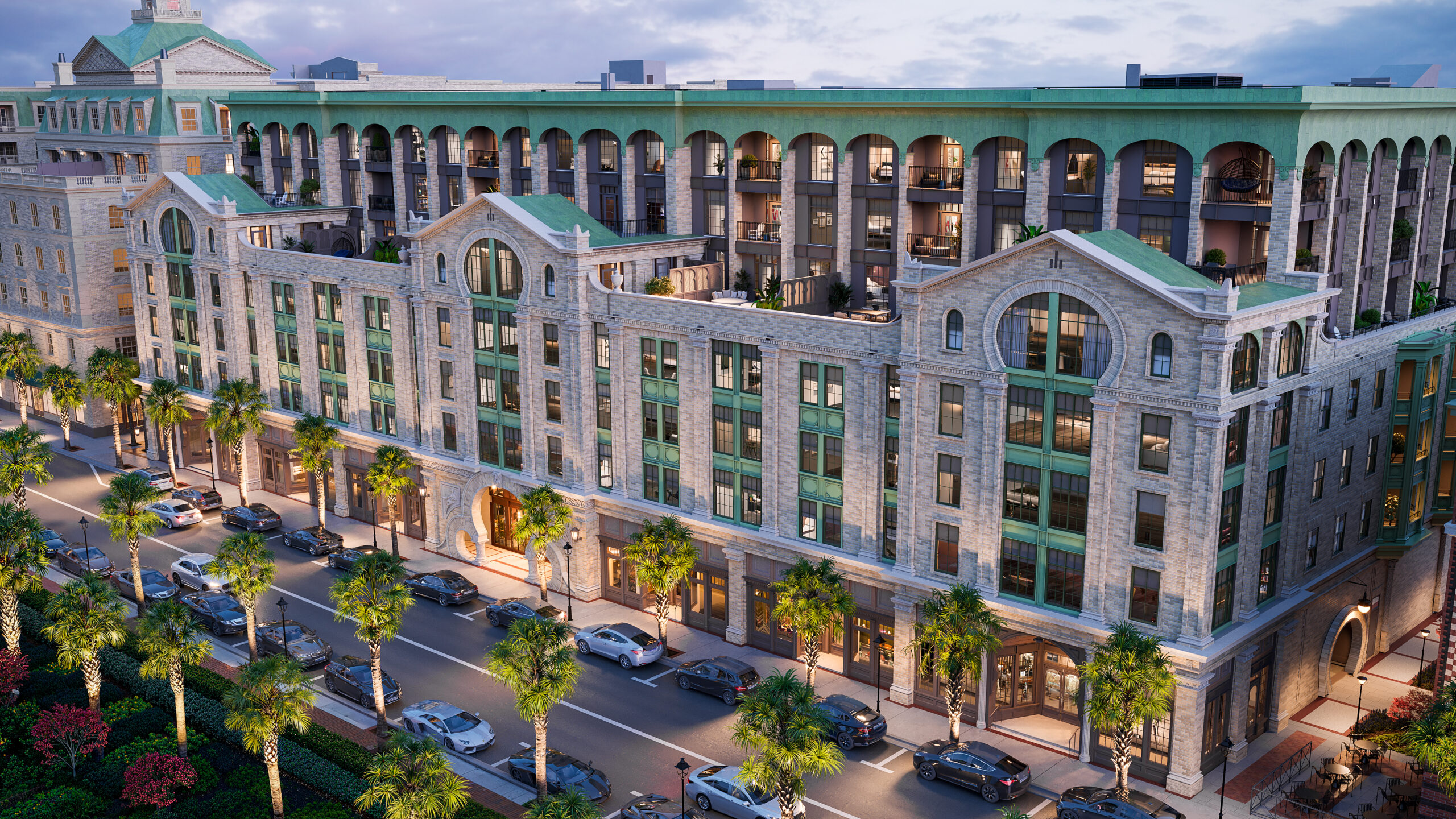 A grand, aerial exterior view of the Laurel building at dusk, showcasing a stunning multi-story tan brick facade with intricate architectural details.
