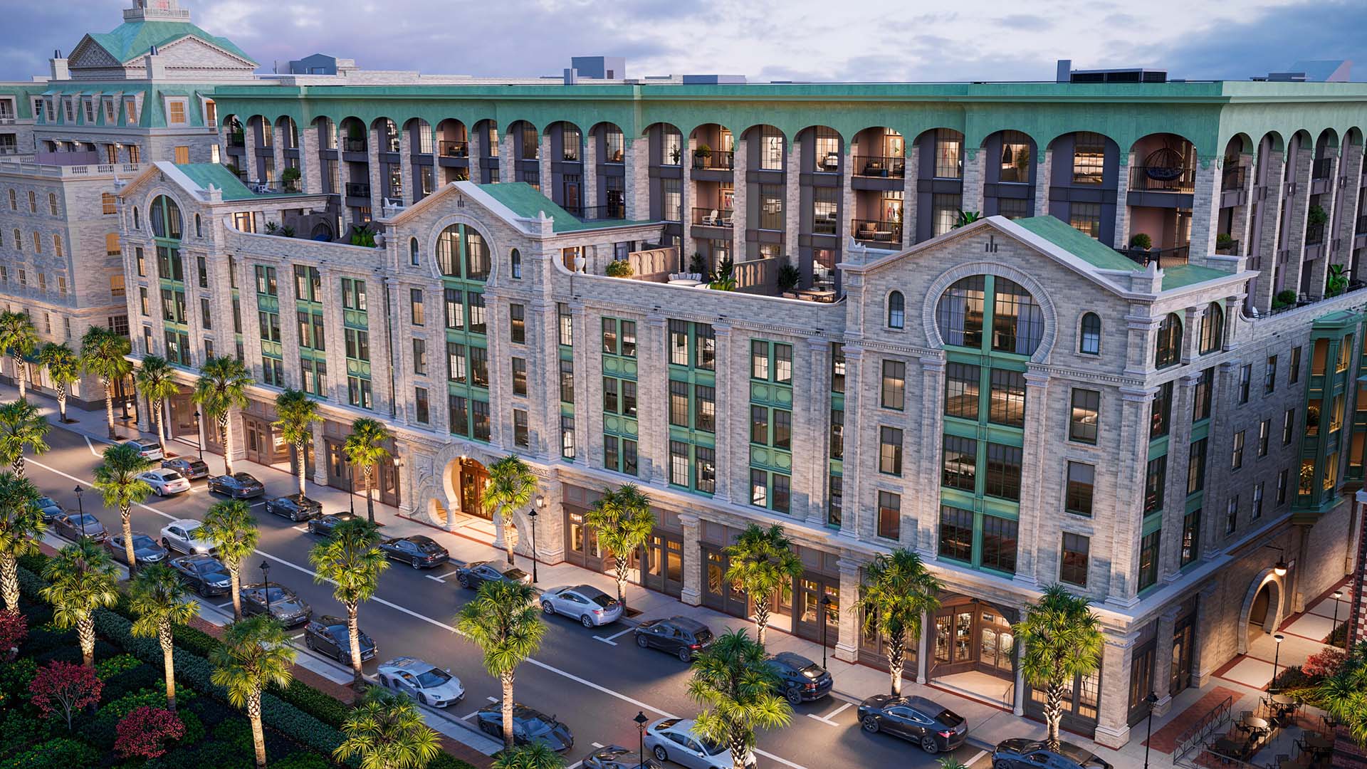 A grand, aerial exterior view of the Laurel building at dusk, showcasing a stunning multi-story tan brick facade with intricate architectural details.