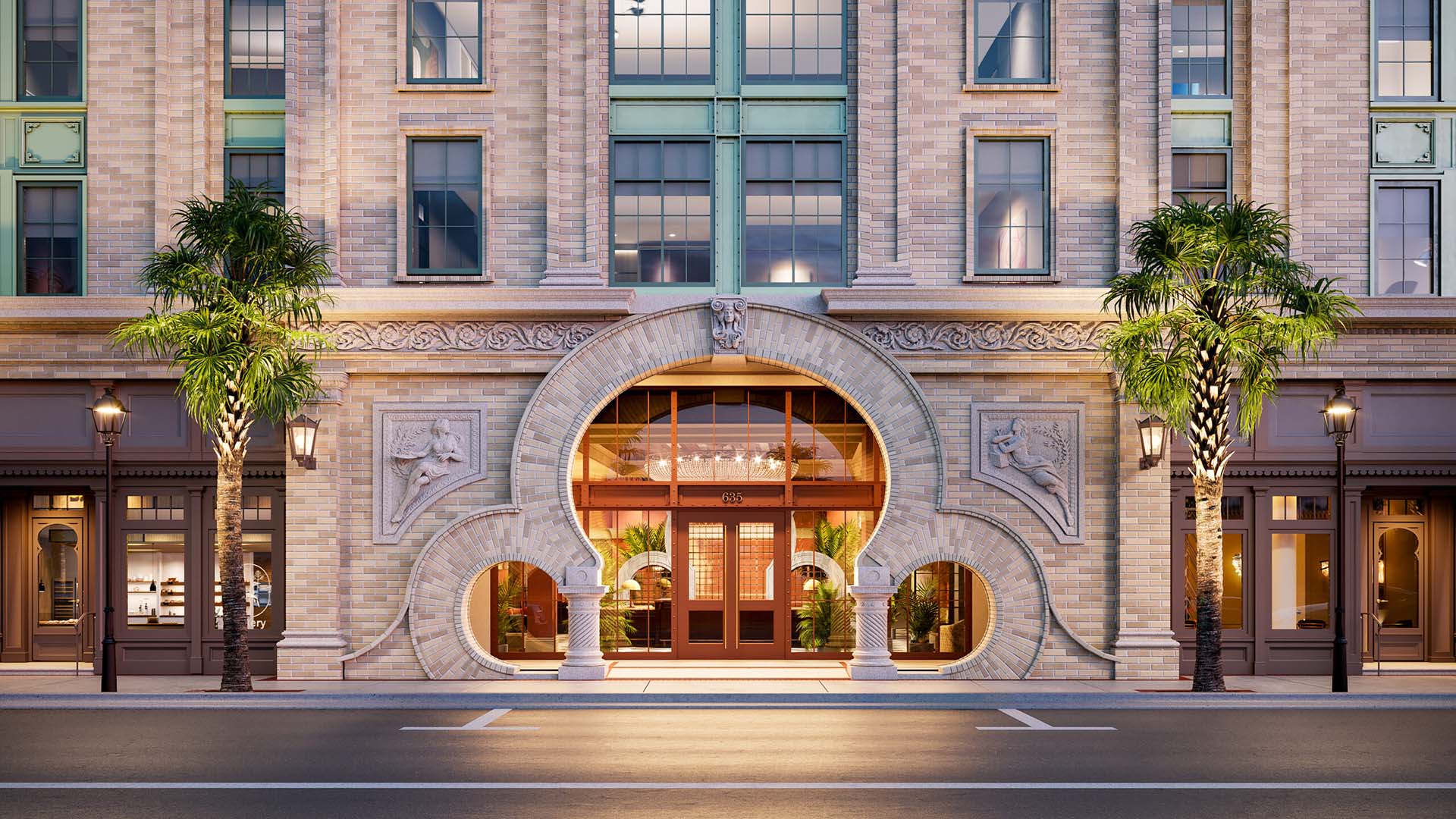 A grand, symmetrical exterior view of the Laurel building at dusk, showcasing a stunning multi-story tan brick facade with intricate architectural details. The focal point is a unique, large stone 