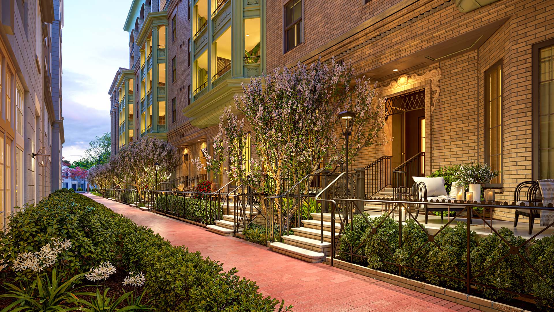 Garden alley walkway at Laurel, A Collective apartments with townhomes and lush landscaping.
