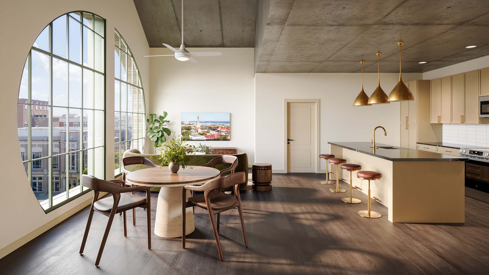 Spacious open-concept living and dining area with large arched windows, modern kitchen island, and natural light at Laurel, A Collective apartments